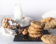 Chocolate chip and nuts cookies with milk food photography