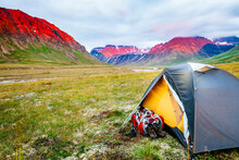 A Tent And Backpack At Sunset In Lake Clark National Park And Preserve, Alaska