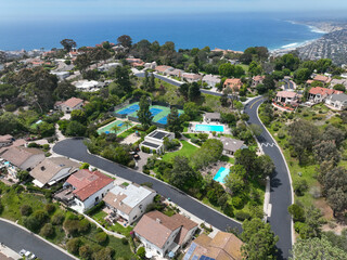 Aerial view over La Jolla Hills with big villas and ocean in the background, San Diego, California, USA