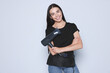 © New Africa - Portrait of happy hairdresser with hairdryer and professional tools on light background