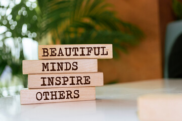 Poster - Wooden blocks with words 'Beautiful Minds Inspire Others'.