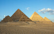 All three main pyramids of Giza. Pyramid of Menkaure, of Khafre or Chephren, of Khufu or Cheops and smal Queen’s pyramids.