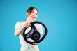 © Timeimage - Image of young Asian woman holding steering wheel