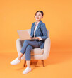 © Timeimage - Photo of young Asian businesswoman sitting on armchair