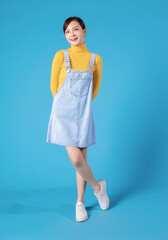 Sticker - Full length photo of young Asian girl standing on blue background