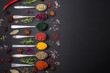© chernikovatv - Variation of spices in metal spoons paprika, turmeric, cardamom, a mixture of allspice, thyme and rosemary