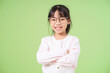 © Timeimage - Portrait of Asian child on green background