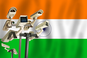 indian cctv camera on the flag of india surveillance, security, control and totalitarianism concept