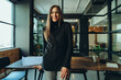 © Jacob Lund - Successful businesswoman smiling happily in an office