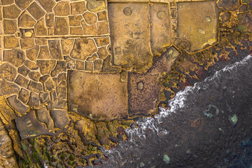 Wall Mural - Patterns in salt pans, Malta. Aerial drone view