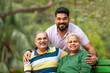 © Niks Ads - Young Indian man with his parents at park