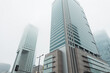 © alones - Modern city of Warsaw, Poland with office and business buildings in the fog