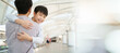 © DG PhotoStock - Happy cheerful Asian little boy running to his father at the railway or sky train station after his father returned from the traveling trip. Happy Asian family father and son concept.