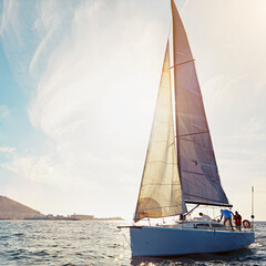 Wall Mural - Ocean, yacht travel and sailing on the sea on vacation by summer sunshine on water. Lens flare, luxury holiday adventure and boat cruise of people in the sun and blue sky in nature with mockup