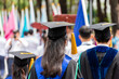 © Patcharanan - Back side view higher education graduation of graduates during commencement. Congratulation in University concept, Education concept.
