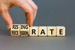 © Dzmitry - Recession or rising rate symbol. Concept word Recession rate Rising rate on wooden cubes. Businessman hand. Beautiful grey table grey background. Business recession or rising rate concept. Copy space.