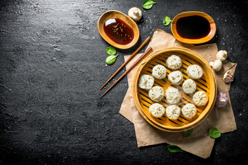 Canvas Print - Traditional food. Dumplings manta with soy sauce in bowls.