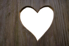 Wooden Board With Sawn Out Heart Shape. Love Backgrounds