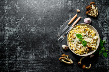 Sticker - Fusilli pasta in a bowl of mushrooms and garlic.