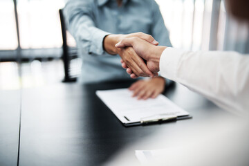 Wall Mural - Business man Successful Ideas team shaking hands in Meeting room.