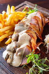 Wall Mural - baked meat in mushroom sauce with potato and salad