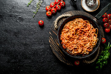 Sticker - Spaghetti with Bolognese sauce in old pan on tray with tomatoes and parsley.