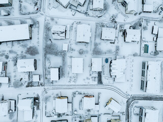 Canvas Print - Aerial view of town with snow covered houses. Roof tops with snow on residential buildings in Switzerland.