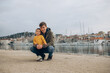 © Kate - happy family on the shore of the port in the Adriatic sea dad and son