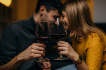 Wall Mural - Close up photo of people toasting with a glass of vine