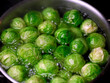 Close up of Brussels sprouts in boiling water pot