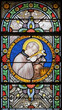 CHAMONIX, FRANCE - JULY 5, 2022: The  St. Aloisius Gonzaga on the stained glass in the church St. Michael by Antonine Bernard (1900).
