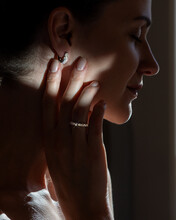 Fefashionable Portrait Of A Girl In Long Diamond Earrings.