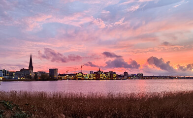 Wall Mural - sunset over the city of rostock, beautiful colored evening sky 