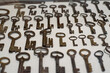 Old, rusty and medieval keys are displayed on white background