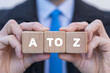 © wladimir1804 - Businessman holding wooden cubes with inscription: A TO Z. A TO Z business education concept.