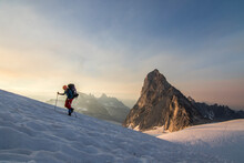 Mountain Climber Traversing Vowell Glacier At Sunset, Bugaboo Mountains, British Columbia, Canada