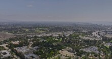 San Diego California Aerial V70 Panoramic Panning View Flyover Balboa Park Capturing Multiple Attractions And Downtown Cityscape With Plane Landing In The Sky - Shot With Mavic 3 Cine - September 2022