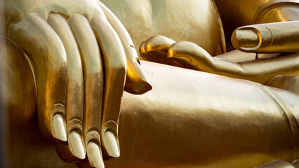 Wall Mural - Hands of a seated Buddha close-up