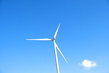 Wall Mural - Wind farm on the mountain. Lonely windmill on a beautiful sunny day. Wind energy concept, alternative energy, renewable energy