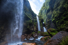 Paroramic Shot Of Three Waterfalls Falling Into The Riverbed In The Middle Of The Tropical Jungle Of Costa Rica
