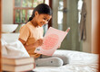 © K. A./peopleimages.com - Child or girl reading for home learning, story and language education with creative development o bed. Happy, kindergarten Indian kid with English books for smart, intelligent and fun house activity