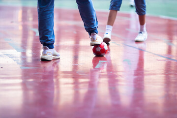 Sticker - Selective focus to red ball with futsal player.