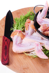 Poster - Raw chicken wings on a white background