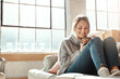 © Grady R/peopleimages.com - Woman on sofa, coffee and relax for happiness, break and on weekend for solitude, home and living room. Young female, girl or tea in lounge on couch, comfortable or smile with drink, house and casual