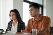 © DragonImages - Serious young couple meeting with insurance agent in office