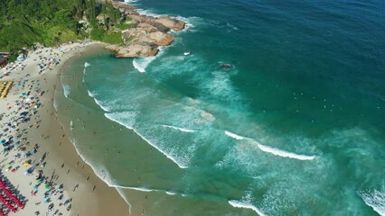 Wall Mural - Popular beach with rocky cape and ocean with waves in Brazil. Aerial view, top view