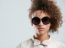 Black Woman, Fashion And Sunglasses Portrait In Studio For Funky, Quirky And Trendy People Style. Assertive Face Of Fashionista Person In Isolated Gray Background For Marketing Mockup.