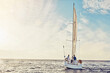 © Grady R/peopleimages.com - Couple sailing on yacht, adventure and travel with nature, luxury vacation on the ocean for summer holiday. Wealthy people out at sea, lifestyle with blue sky, romantic getaway with seascape mockup