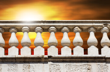 Wall Mural - Close-up of a white marble balustrade in classical style against a beautiful sky at sunset with copy space. Brescia downtown, Lombardy, Italy, Europe. 