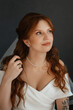 © omelnickiy - portrait of a bride girl with red hair in a white wedding dress